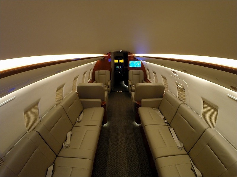 Private jet cabin looking forward through the seat rows on a Naples, Florida charter