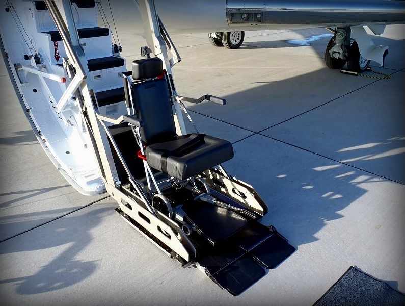Wheelchair lift platform at the airstair door of a private jet in Naples, Florida